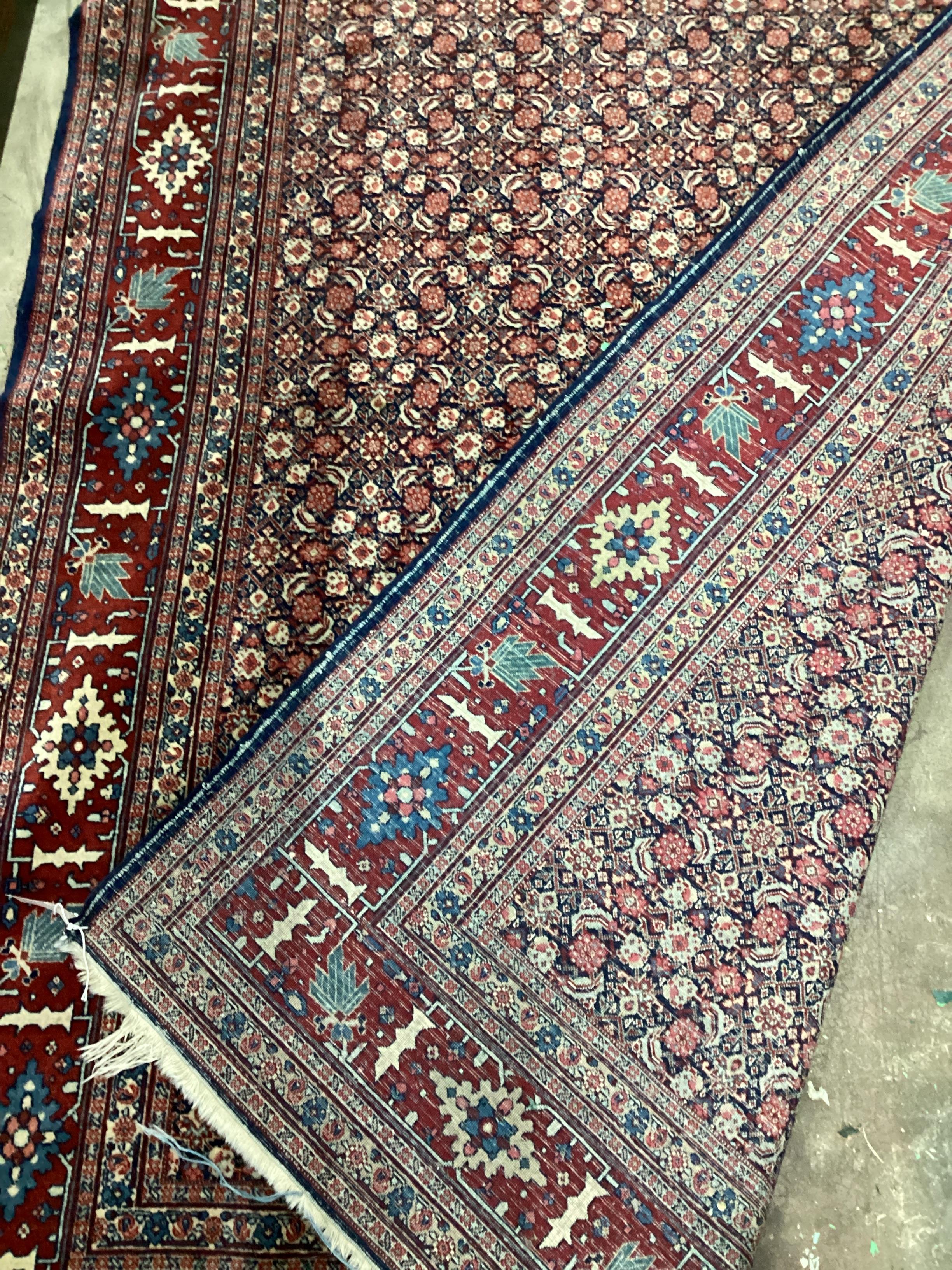 A North West Persian blue ground rug, 206 x 140cm